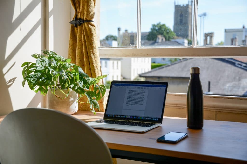 home office desk set up with outside view