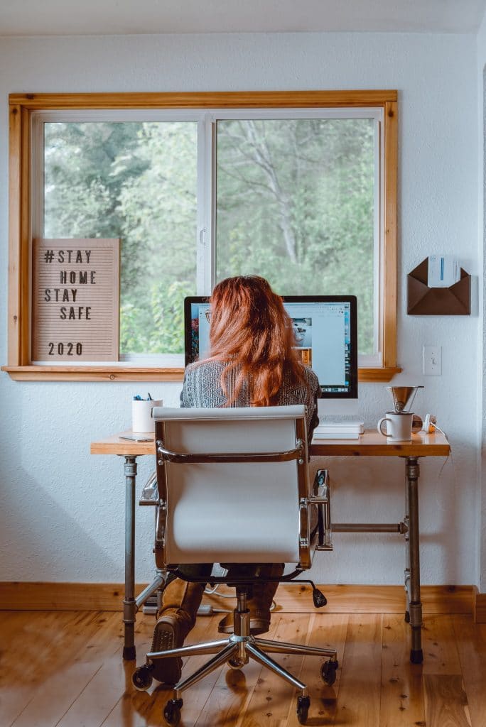 woman working at computer from her home office