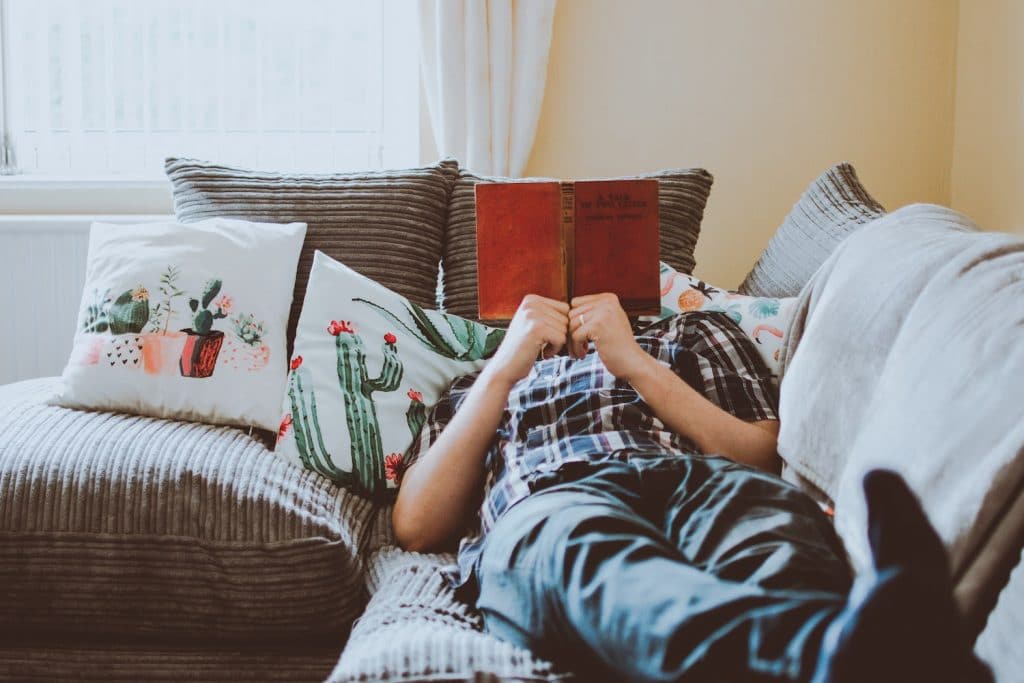 Man relaxing reading a book holiday season rest