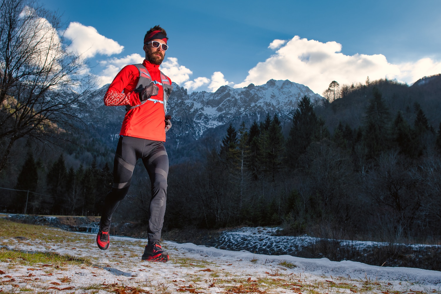 Long distance runner in the mountains during a winter training