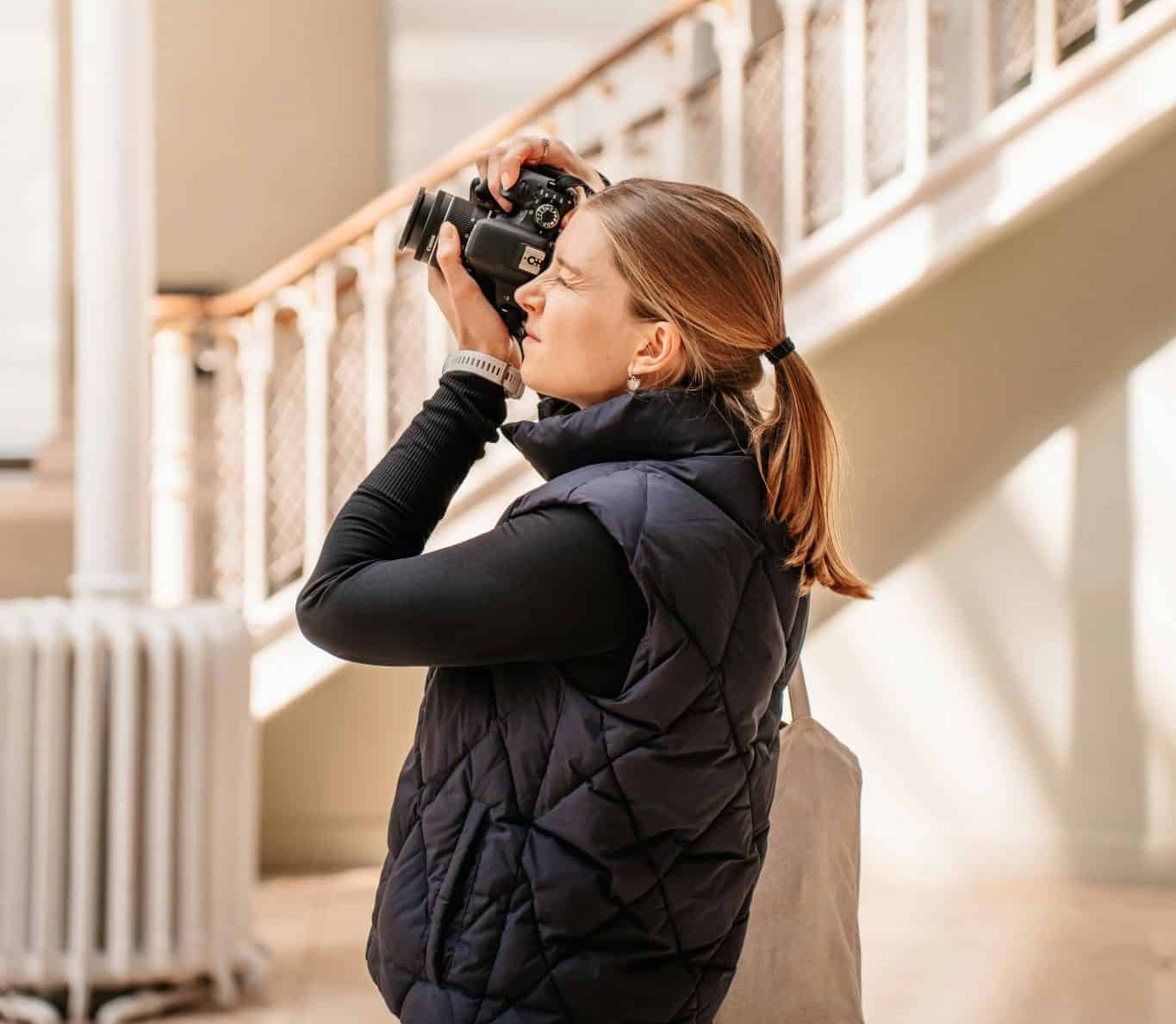 image of a photographer capturing a decisive moment, symbolizing focused creativity.