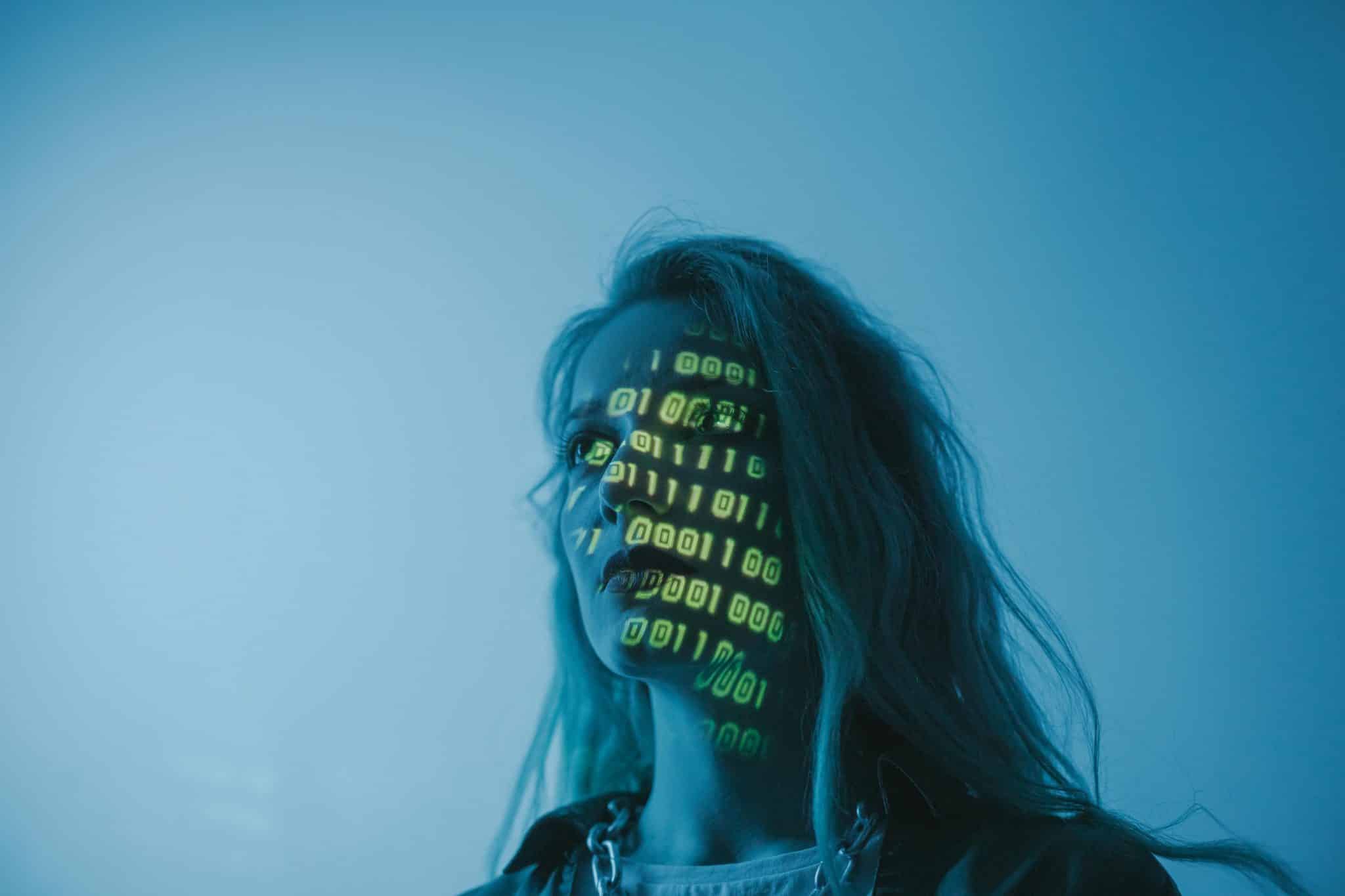 Woman stepping away from screen, seeking calm after digital overstimulation