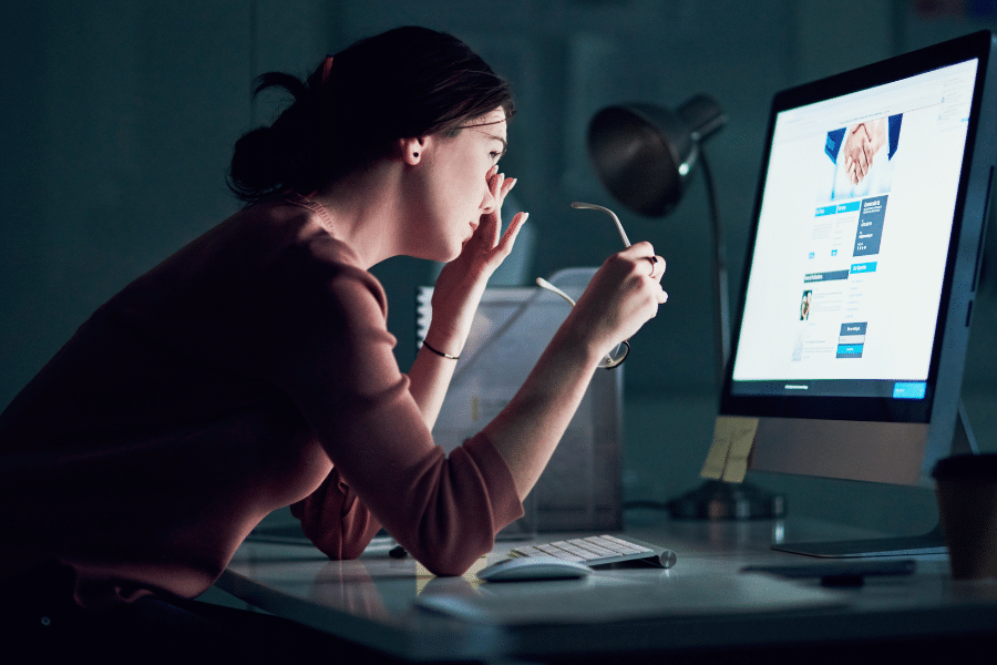 Woman at computer - weary